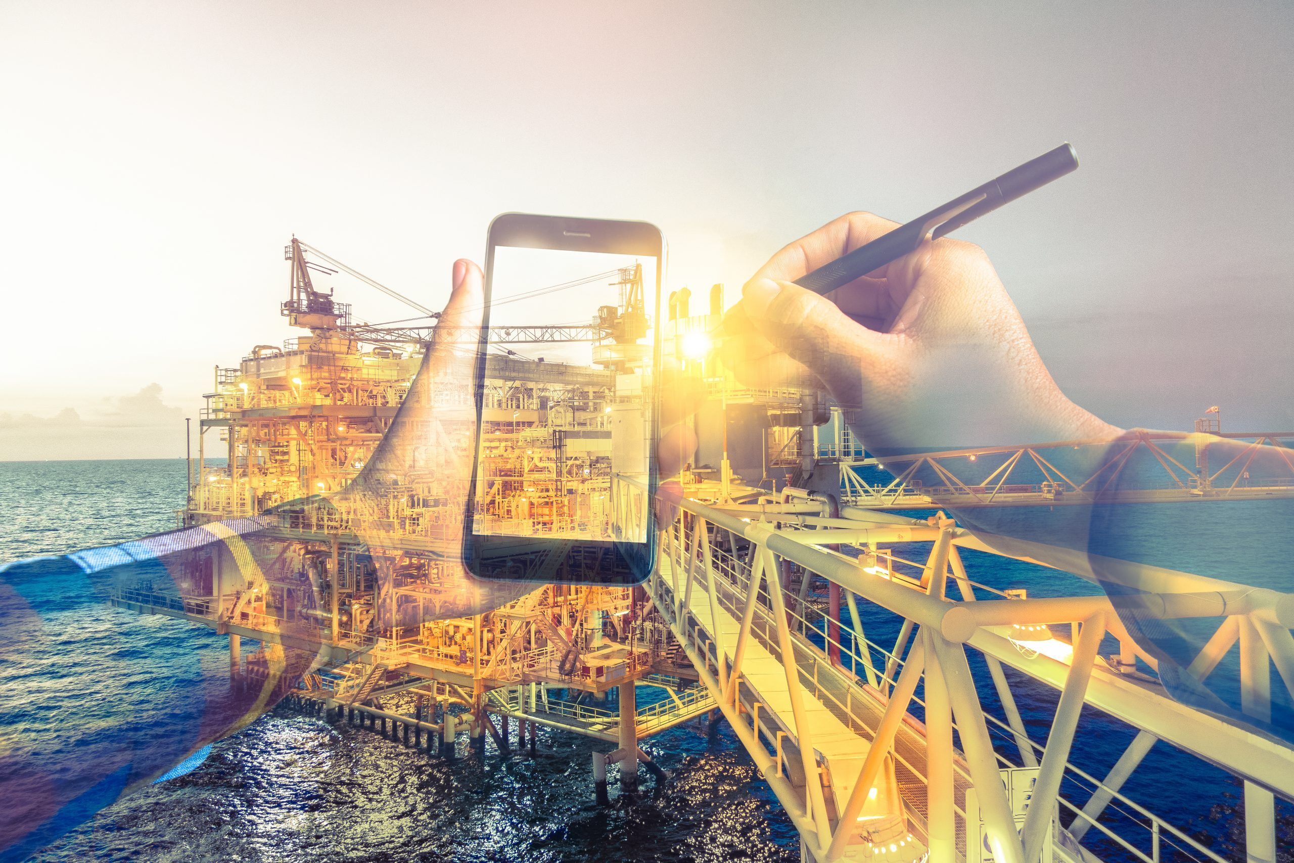 Double exposure of refinery oil and gas background, and businessman on hipster shirt use mobile phone